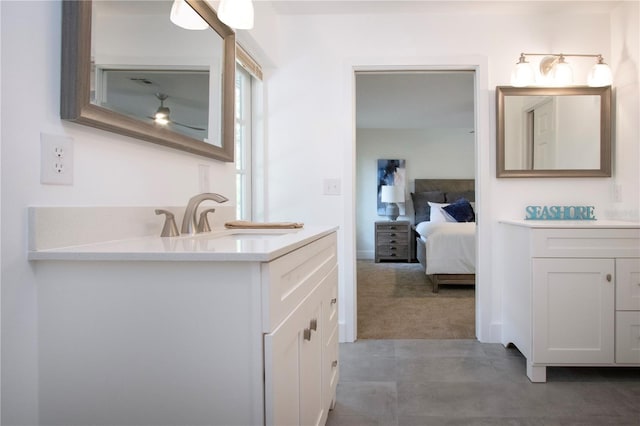 800 Everest Rd, Venice, FL 34293 - bathroom featuring vanity, tile patterned flooring, ceiling fan, and connected bathroom