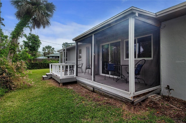 800 Everest Rd, Venice, FL 34293 - deck featuring fence, a yard, and a sunroom