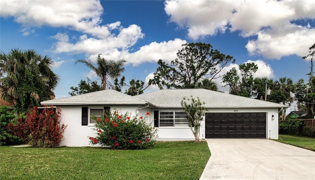 800 Everest Rd, Venice, FL 34293 - single story home featuring concrete driveway, a front yard, an attached garage, and stucco siding