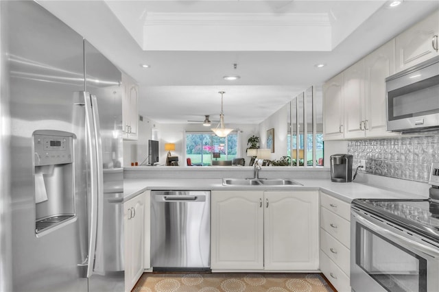 kitchen featuring a sink, light countertops, white cabinets, and stainless steel appliances