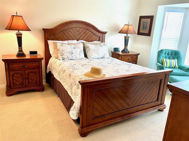 bedroom featuring light carpet