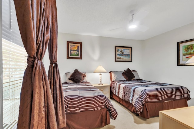 carpeted bedroom featuring a ceiling fan