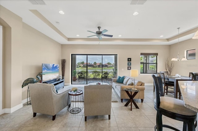 1290 Cielo Ct, North Venice, FL 34275 - living area featuring a tray ceiling, ceiling fan, baseboards, and recessed lighting