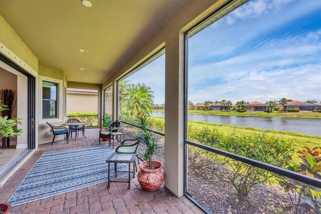 1290 Cielo Ct, North Venice, FL 34275 - sunroom / solarium with a water view