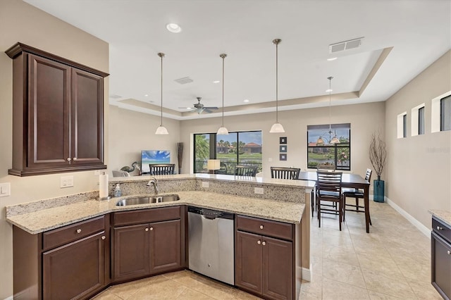 1290 Cielo Ct, North Venice, FL 34275 - kitchen featuring stainless steel dishwasher, a raised ceiling, a sink, dark brown cabinets, and recessed lighting