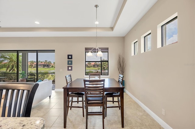 1290 Cielo Ct, North Venice, FL 34275 - dining space with light tile patterned floors, recessed lighting, baseboards, and a tray ceiling