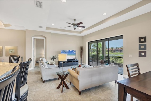 1290 Cielo Ct, North Venice, FL 34275 - living room with a ceiling fan, baseboards, a raised ceiling, light tile patterned floors, and recessed lighting