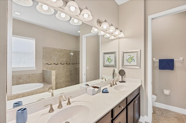 1290 Cielo Ct, North Venice, FL 34275 - bathroom featuring toilet, double vanity, a tile shower, and tile patterned flooring