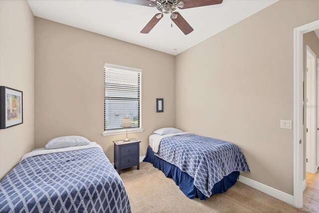 1290 Cielo Ct, North Venice, FL 34275 - bedroom featuring light carpet, baseboards, and a ceiling fan