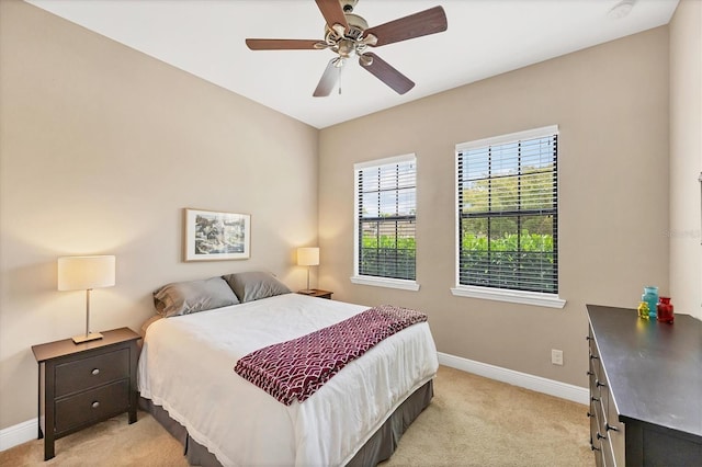 1290 Cielo Ct, North Venice, FL 34275 - bedroom featuring baseboards, light colored carpet, and a ceiling fan