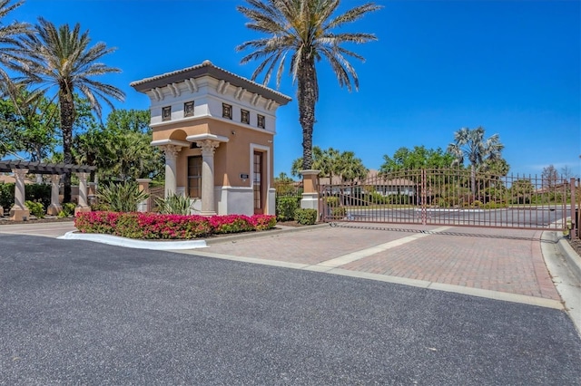 1290 Cielo Ct, North Venice, FL 34275 - exterior space featuring a gate, curbs, and a gated entry