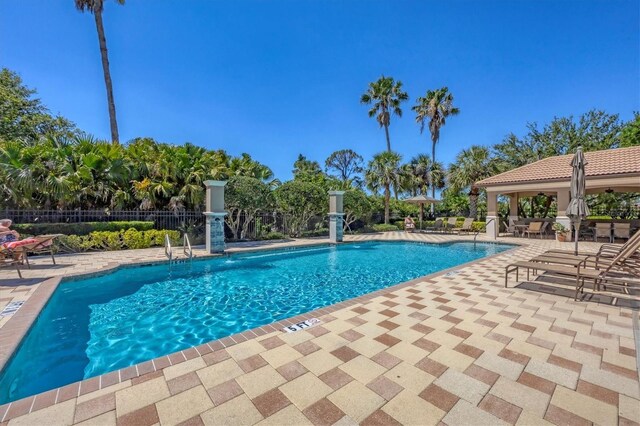 1290 Cielo Ct, North Venice, FL 34275 - community pool featuring a patio and fence
