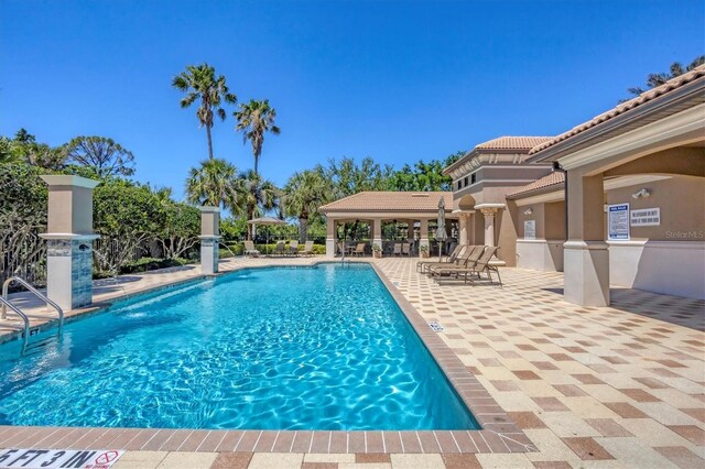 1290 Cielo Ct, North Venice, FL 34275 - community pool with a patio area