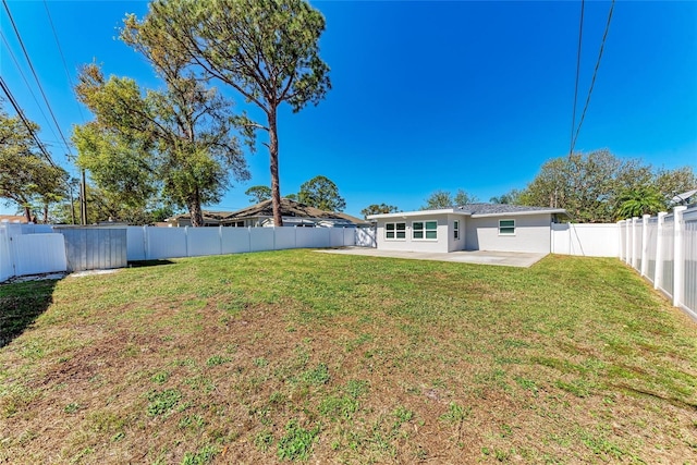 view of yard with a patio and a fenced backyard