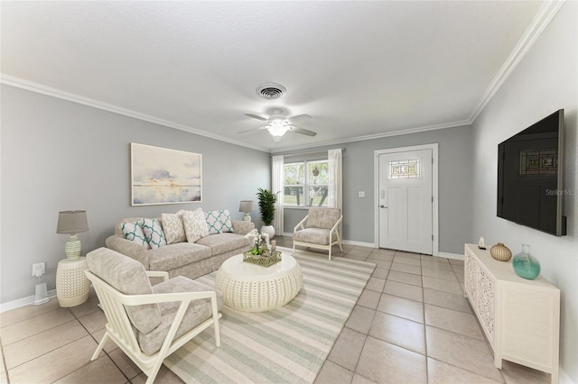 living area featuring crown molding, visible vents, and baseboards