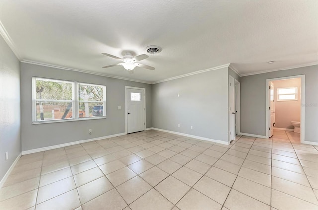 interior space featuring crown molding, light tile patterned floors, and visible vents