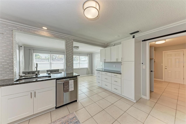 kitchen featuring ornamental molding, dishwasher, and a sink