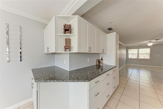 kitchen with a ceiling fan, visible vents, open shelves, white cabinets, and crown molding