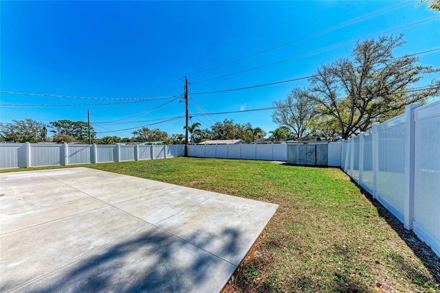 view of yard featuring a patio and a fenced backyard