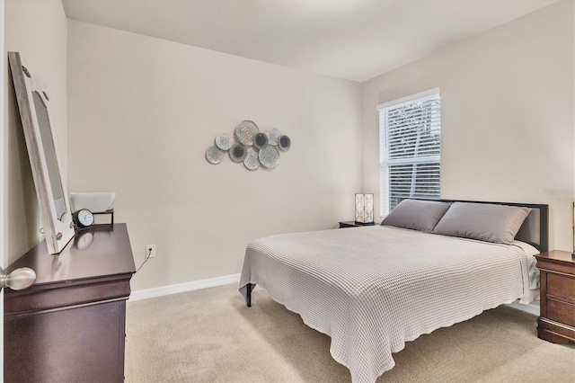 carpeted bedroom with baseboards