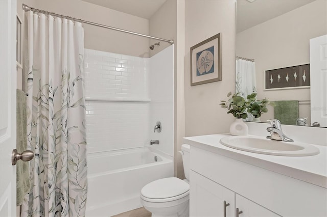 bathroom with vanity, shower / bath combination with curtain, and toilet