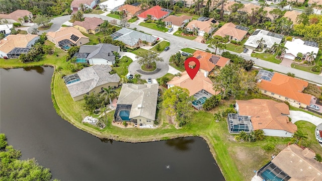 bird's eye view featuring a residential view and a water view