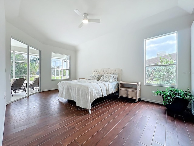 bedroom featuring ceiling fan, baseboards, dark wood-type flooring, and access to exterior