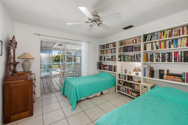 bedroom with access to outside, light tile patterned floors, visible vents, and ceiling fan