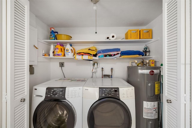 laundry room featuring laundry area, separate washer and dryer, and water heater