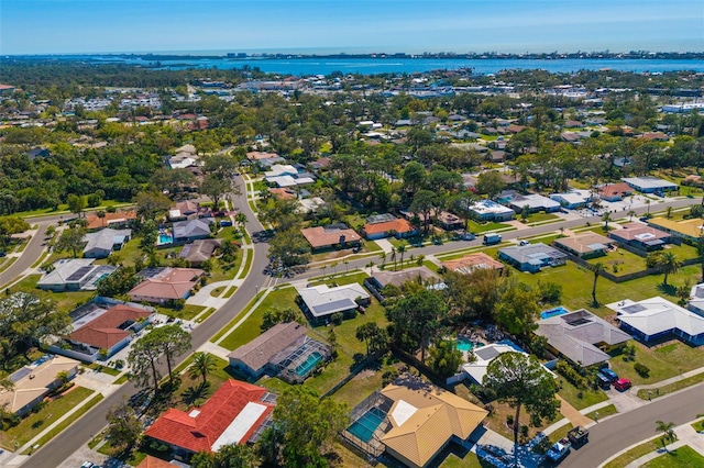 bird's eye view featuring a residential view and a water view