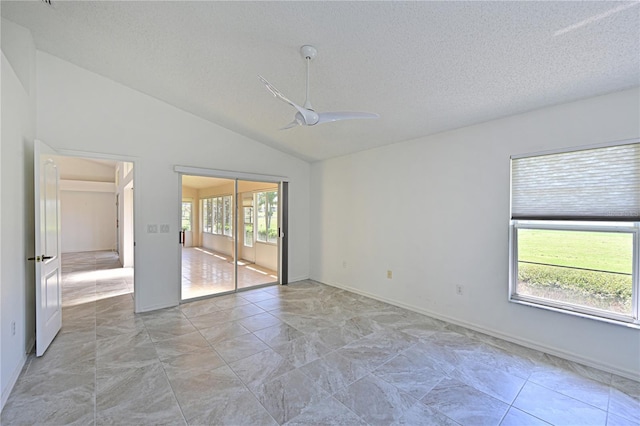 unfurnished bedroom with a textured ceiling, a ceiling fan, and vaulted ceiling