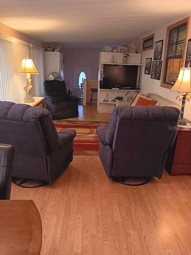 living room with wood finished floors