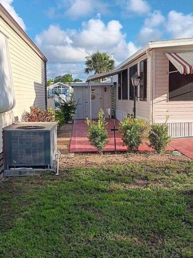 view of yard featuring central AC unit