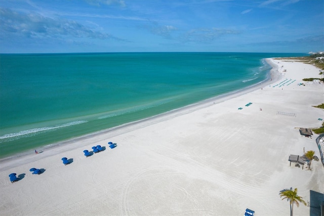 bird's eye view featuring a view of the beach and a water view