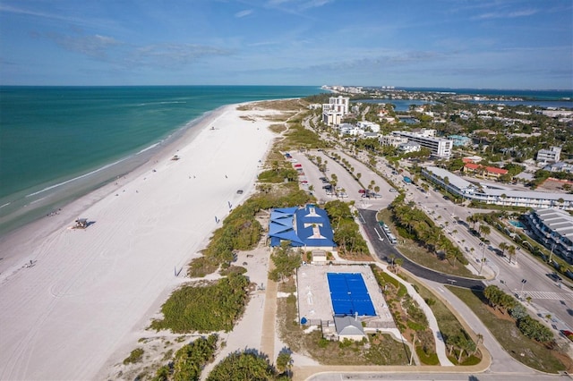 drone / aerial view featuring a view of the beach and a water view