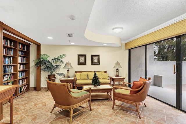 sitting room featuring crown molding, recessed lighting, visible vents, and a textured ceiling