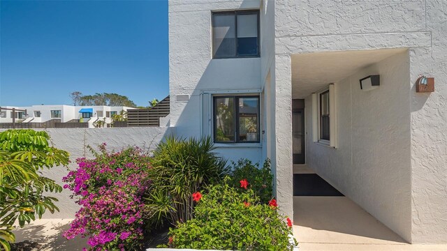 doorway to property with stucco siding