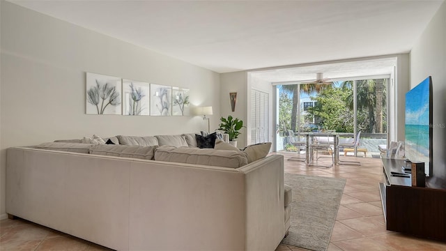 living room with light tile patterned floors and expansive windows