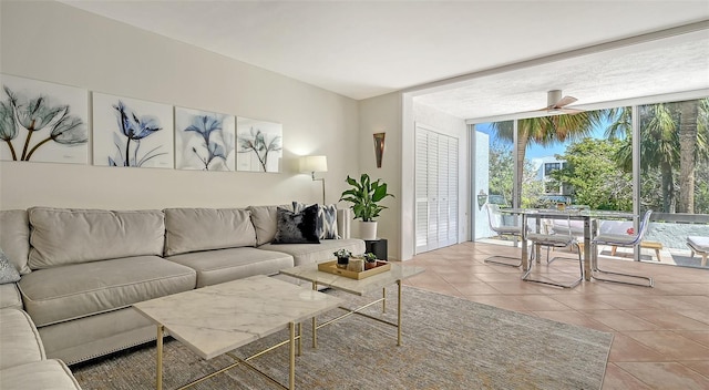 living area featuring tile patterned floors and floor to ceiling windows