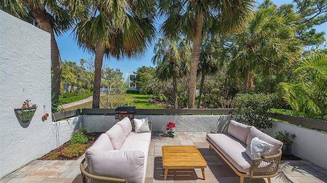 view of patio / terrace featuring outdoor lounge area and fence