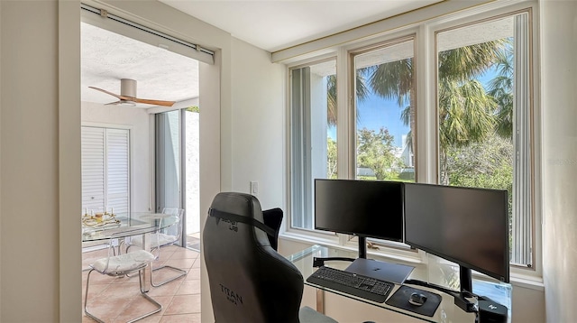 office space featuring light tile patterned floors and a ceiling fan