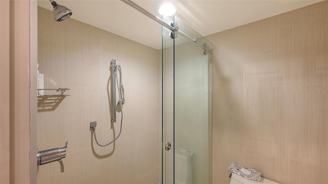 bathroom with a shower stall