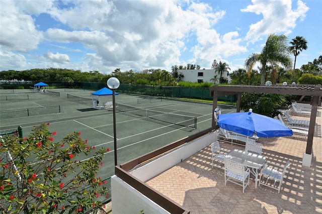 view of sport court with fence