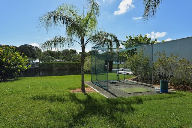 view of property's community featuring a yard and a water view