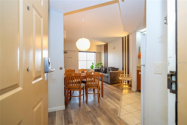 dining area featuring light wood-type flooring