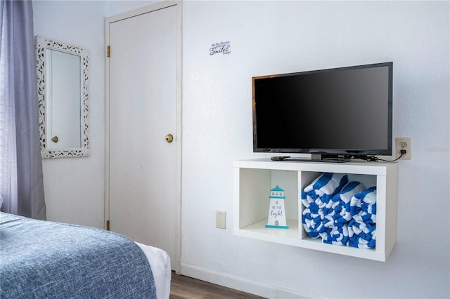 bedroom featuring wood finished floors