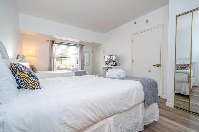 bedroom featuring a closet and wood finished floors