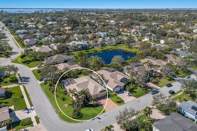 bird's eye view featuring a residential view and a water view