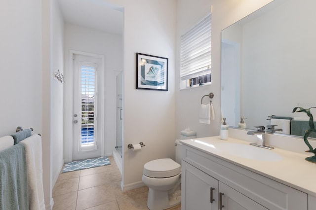 full bath with vanity, baseboards, a shower, tile patterned floors, and toilet