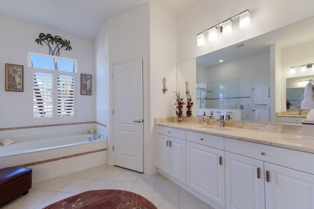 bathroom featuring vanity, tile patterned floors, a garden tub, and walk in shower